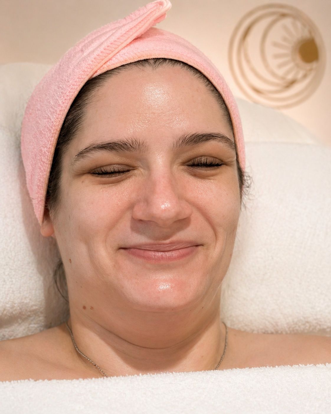 Client with calm, refreshed glow after RF skin tightening at Ancora Body, Englewood NJ